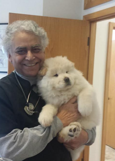 Dr. Kamal Walia with white dog